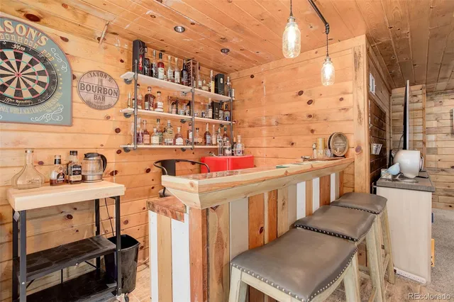 a utility room with multiple dryer and washer