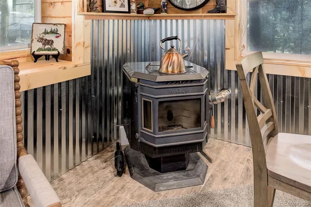 a view of a livingroom with furniture and staircase