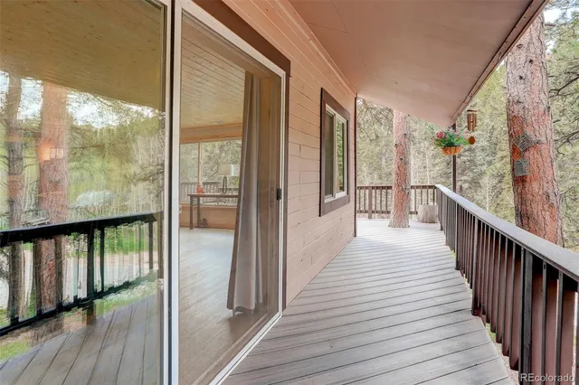 a view of a balcony with wooden floor