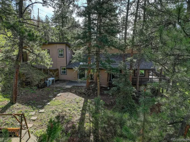 a backyard of a house with seating space