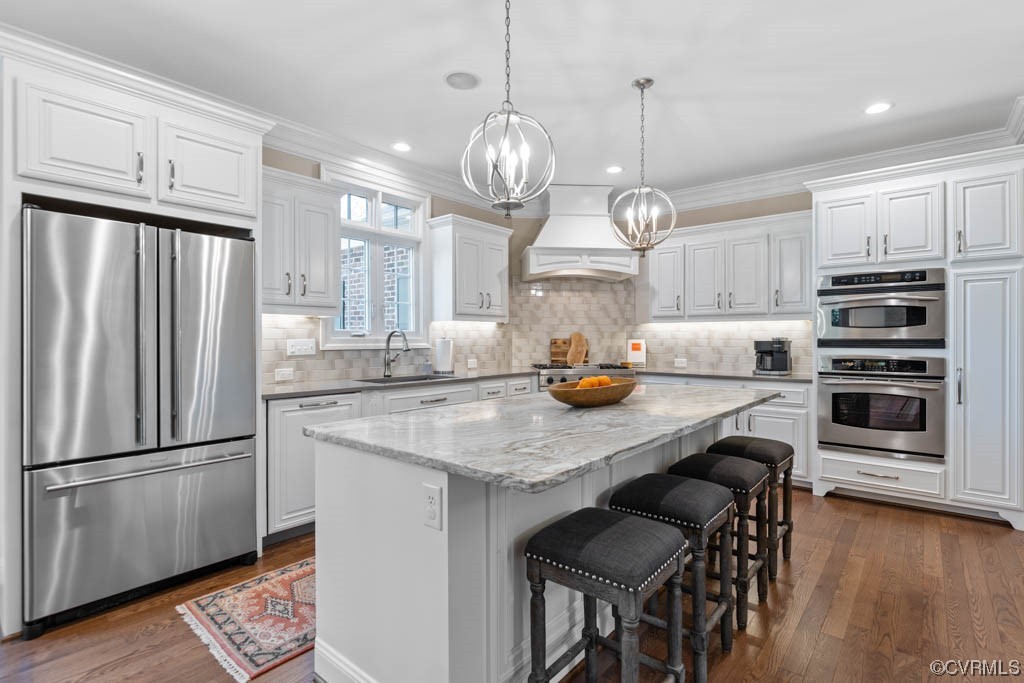 2436 Founders Bridge Road Midlothian, VA 23113 - Photo 14 of 45 a kitchen with granite countertop a stove a refrigerator and wooden floor