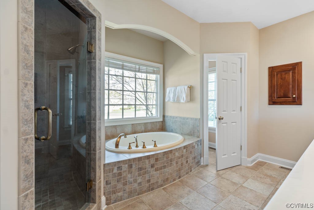 2436 Founders Bridge Road Midlothian, VA 23113 - Photo 21 of 45 a bathroom with a tub a sink and a window