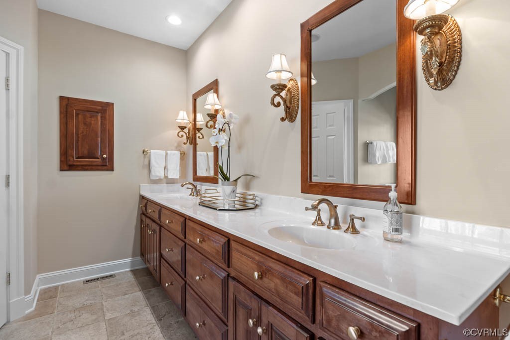 2436 Founders Bridge Road Midlothian, VA 23113 - Photo 22 of 45 a bathroom with a granite countertop sink and a mirror