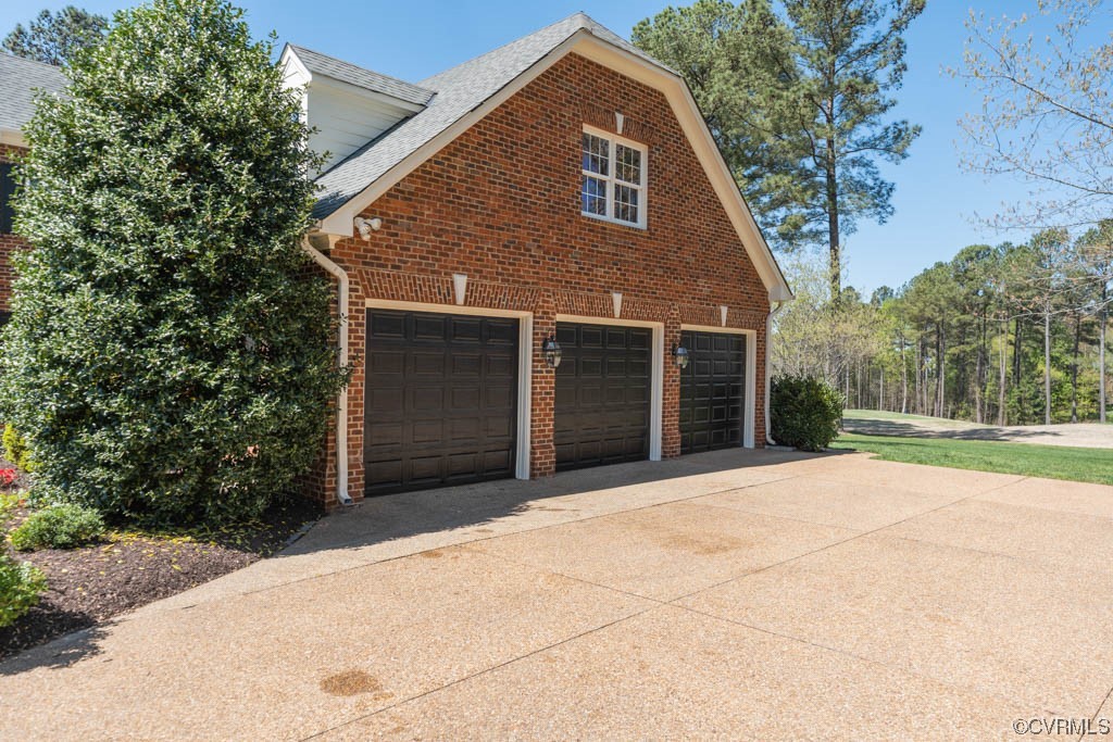 2436 Founders Bridge Road Midlothian, VA 23113 - Photo 5 of 45 a front view of a house with a yard and garage