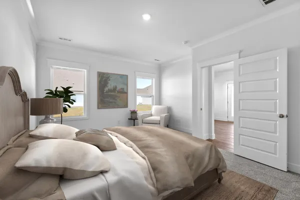 a bedroom with a bed and a painting on the wall