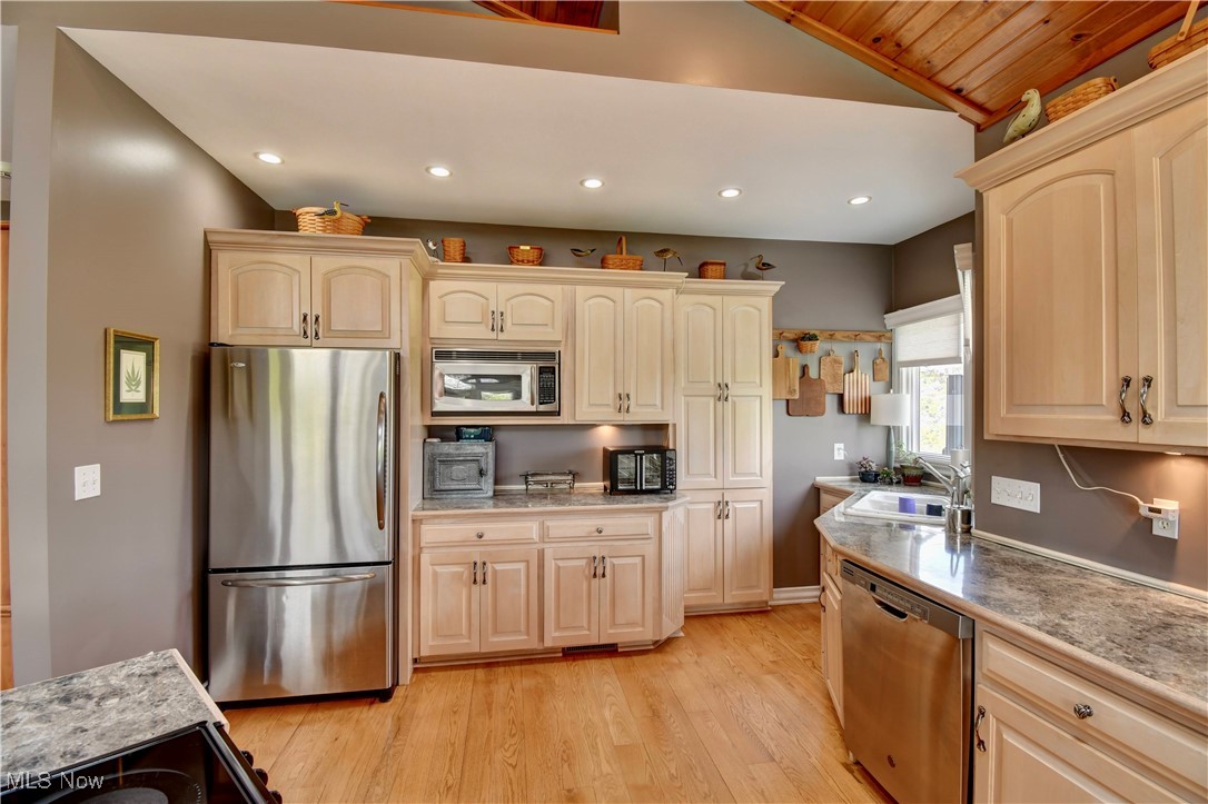 85530 Beagle Club Road Scio, OH 43988 - Photo 16 of 49 Kitchen featuring stainless steel appliances, a sink, light wood-style flooring, lofted ceiling, and recessed lighting