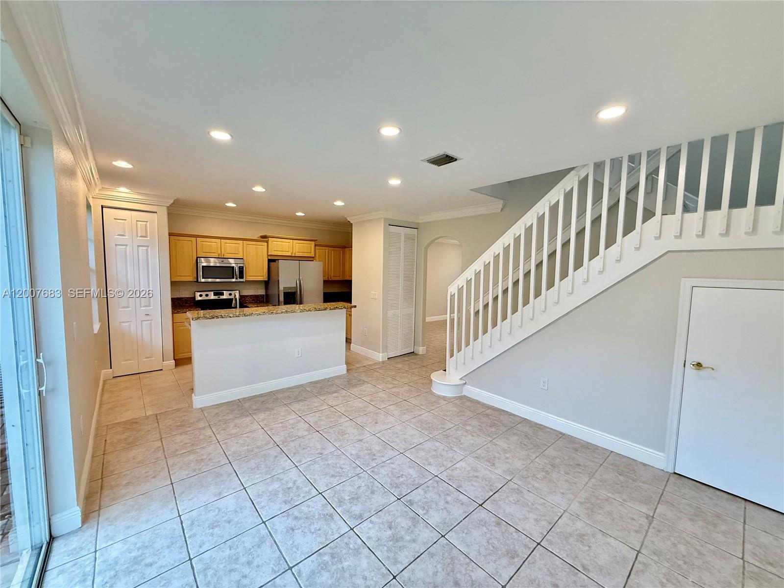 2674 Southwest 84th Terrace, Unit 102 Miramar, FL 33025 - Photo 18 of 57 a view of a kitchen with kitchen and microwave