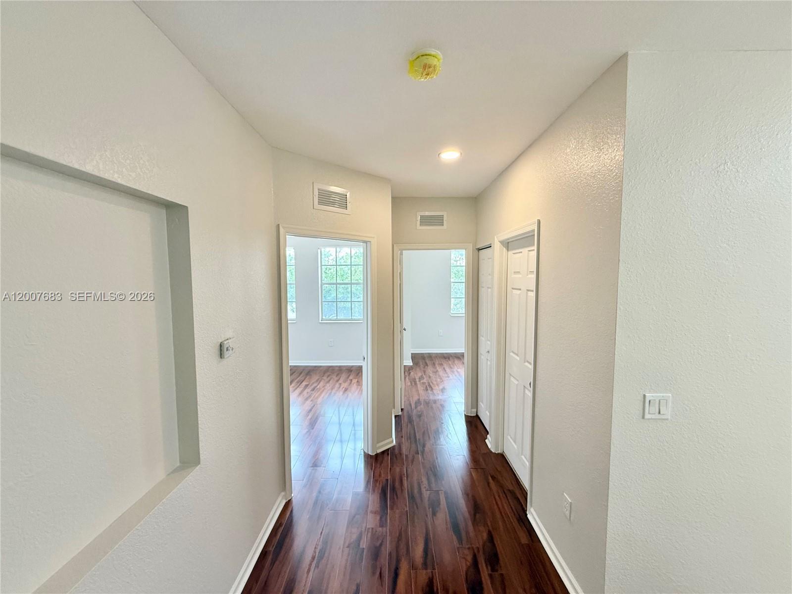 2674 Southwest 84th Terrace, Unit 102 Miramar, FL 33025 - Photo 20 of 57 a view of hallway with wooden floor