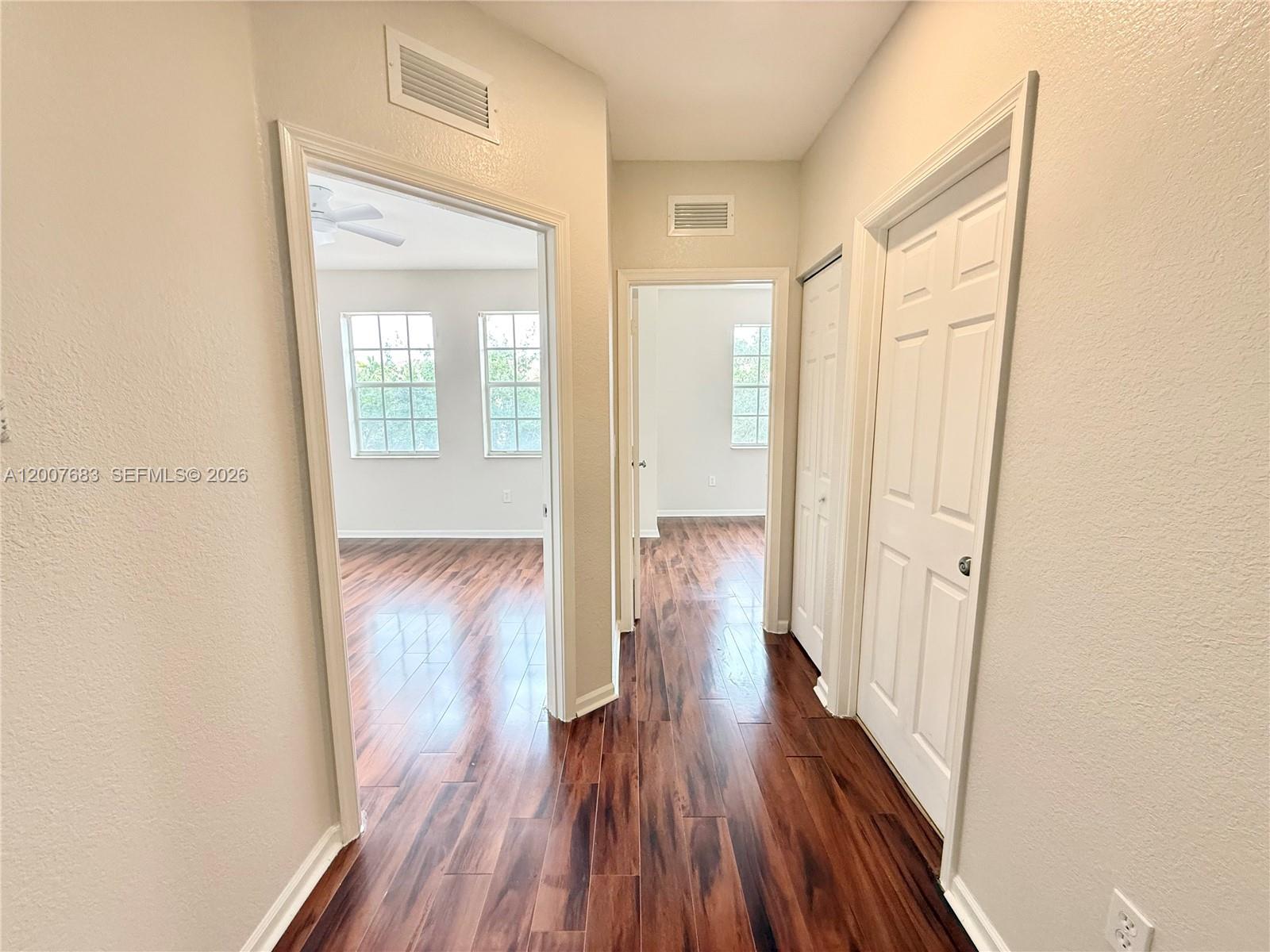 2674 Southwest 84th Terrace, Unit 102 Miramar, FL 33025 - Photo 21 of 57 a view of a hallway with wooden floor and staircase