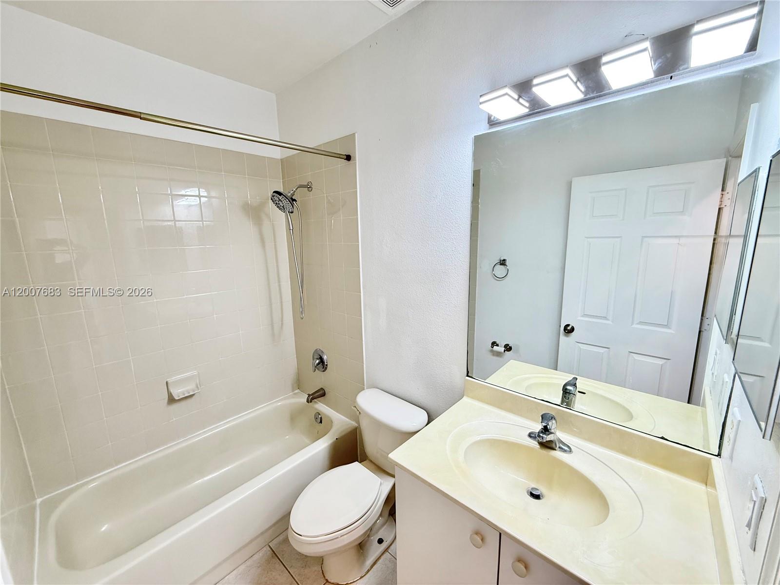 2674 Southwest 84th Terrace, Unit 102 Miramar, FL 33025 - Photo 30 of 57 a bathroom with a sink toilet tub and shower