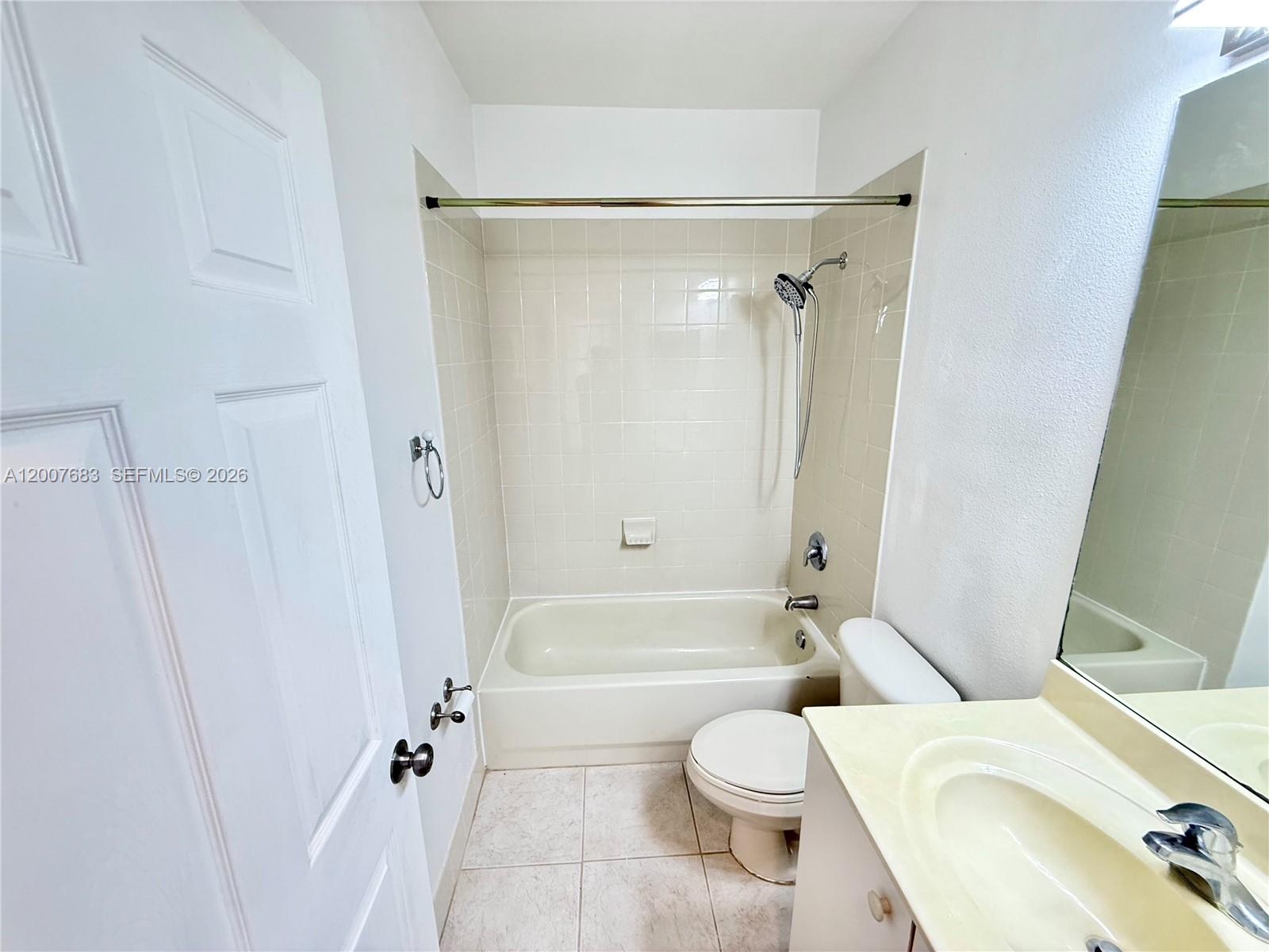 2674 Southwest 84th Terrace, Unit 102 Miramar, FL 33025 - Photo 31 of 57 a bathroom with a toilet and a shower