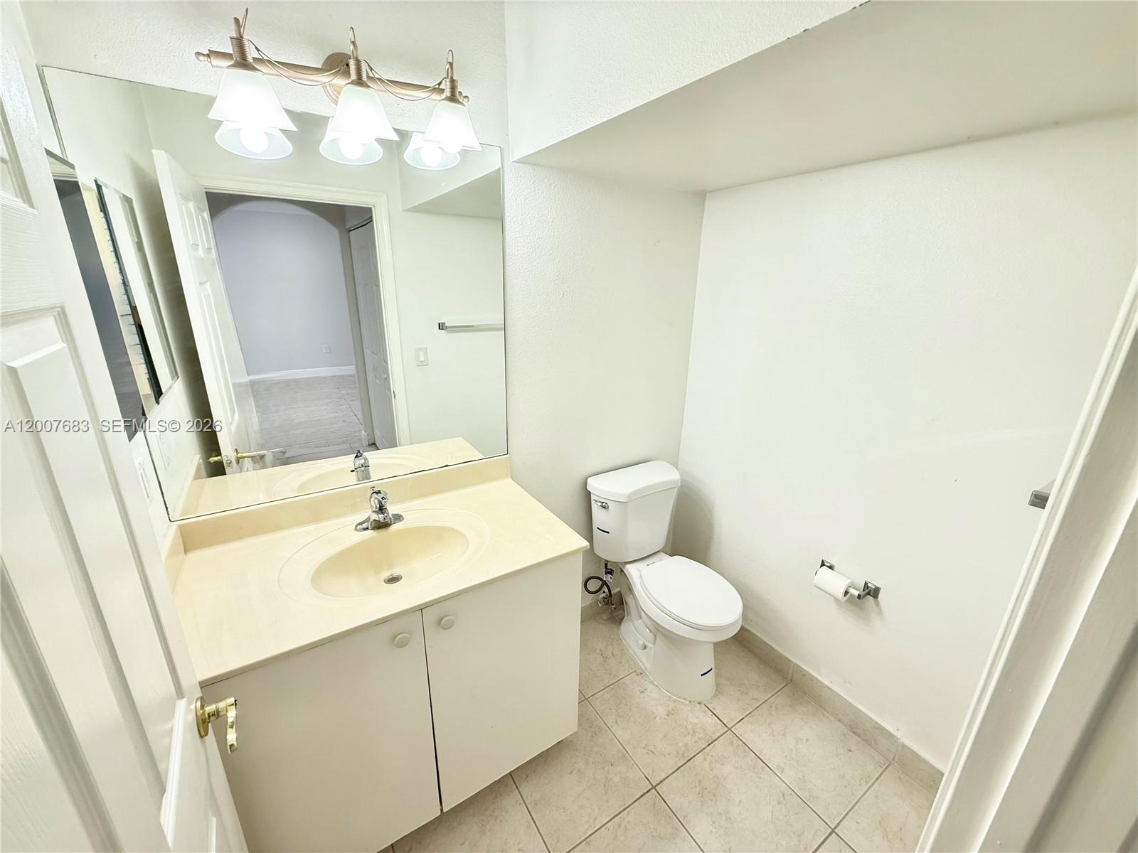 2674 Southwest 84th Terrace, Unit 102 Miramar, FL 33025 - Photo 48 of 57 a bathroom with a sink and a mirror