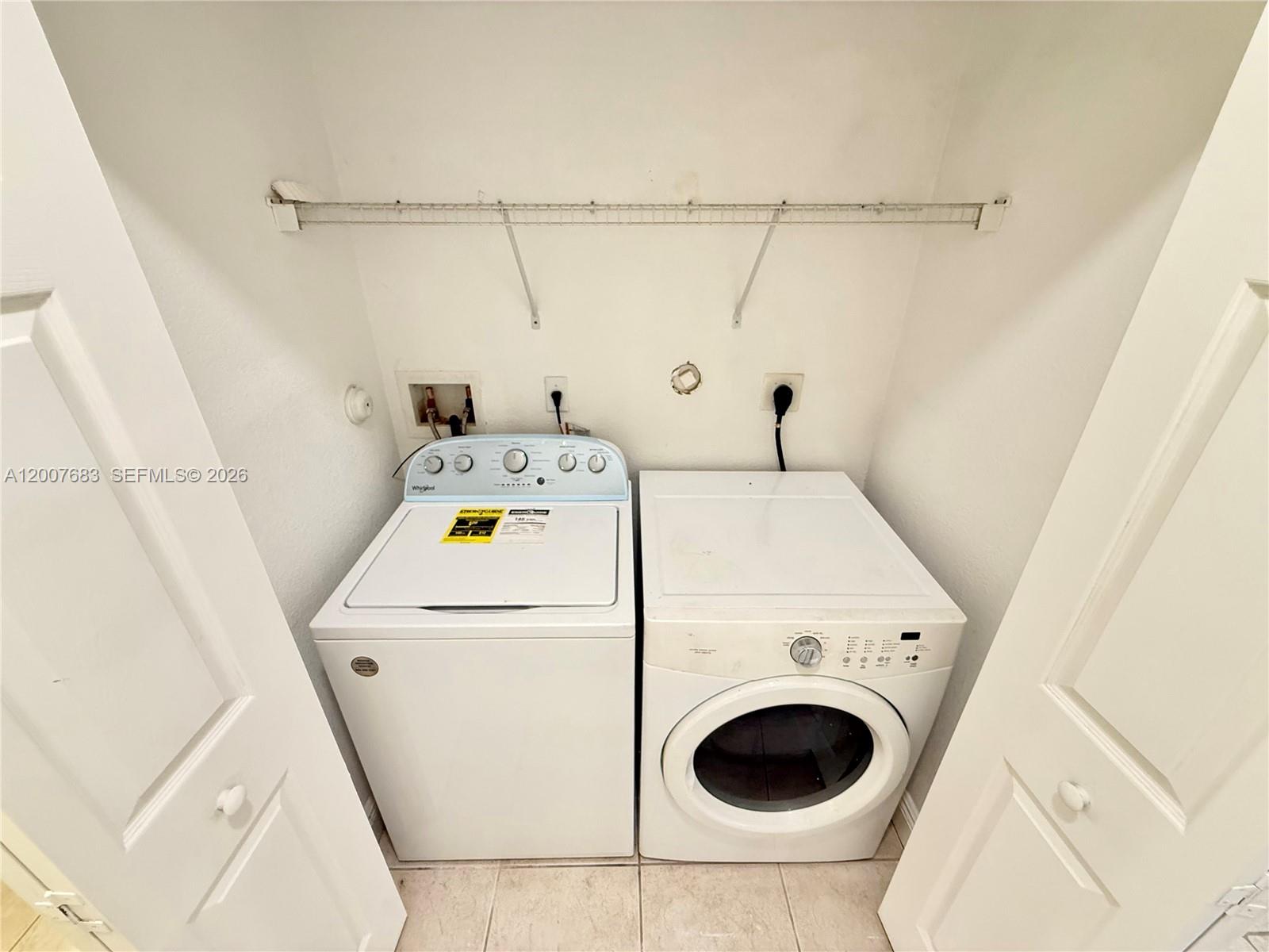 2674 Southwest 84th Terrace, Unit 102 Miramar, FL 33025 - Photo 50 of 57 a utility room with dryer and washer