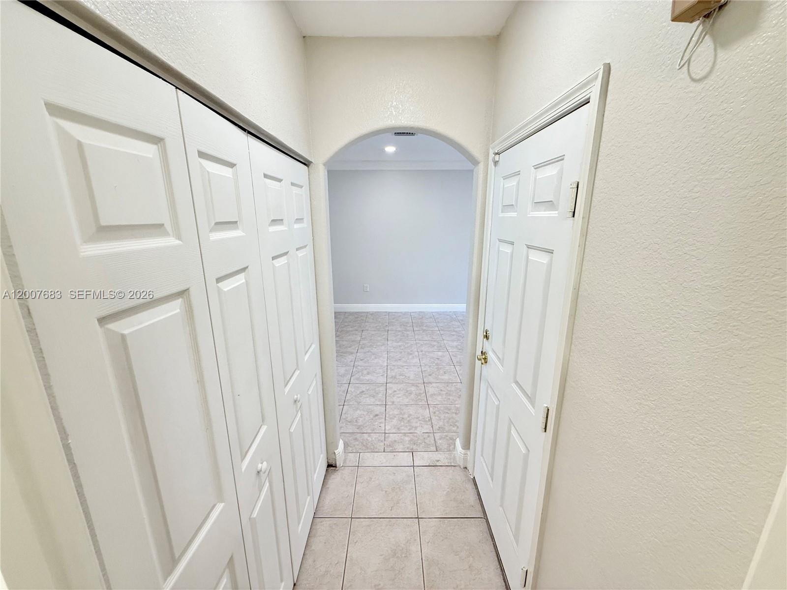 2674 Southwest 84th Terrace, Unit 102 Miramar, FL 33025 - Photo 51 of 57 a view of a hallway with wooden floor and staircase