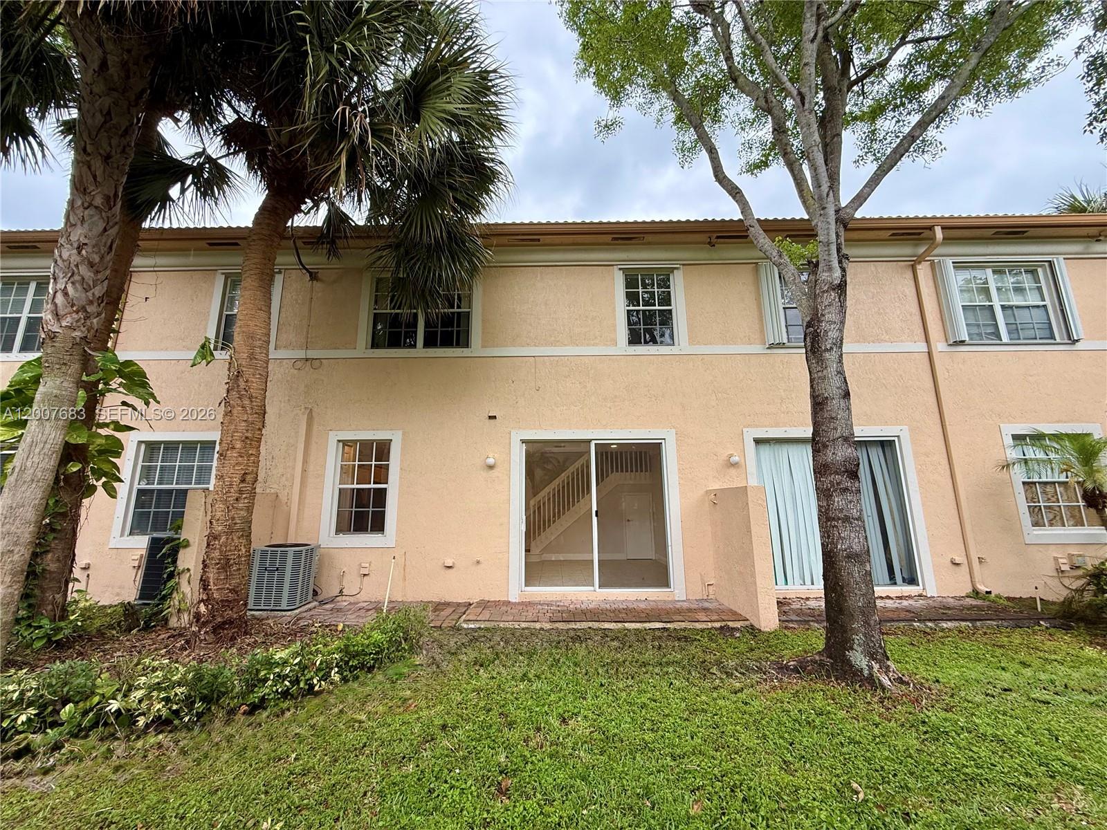 2674 Southwest 84th Terrace, Unit 102 Miramar, FL 33025 - Photo 52 of 57 front view of a house with a yard