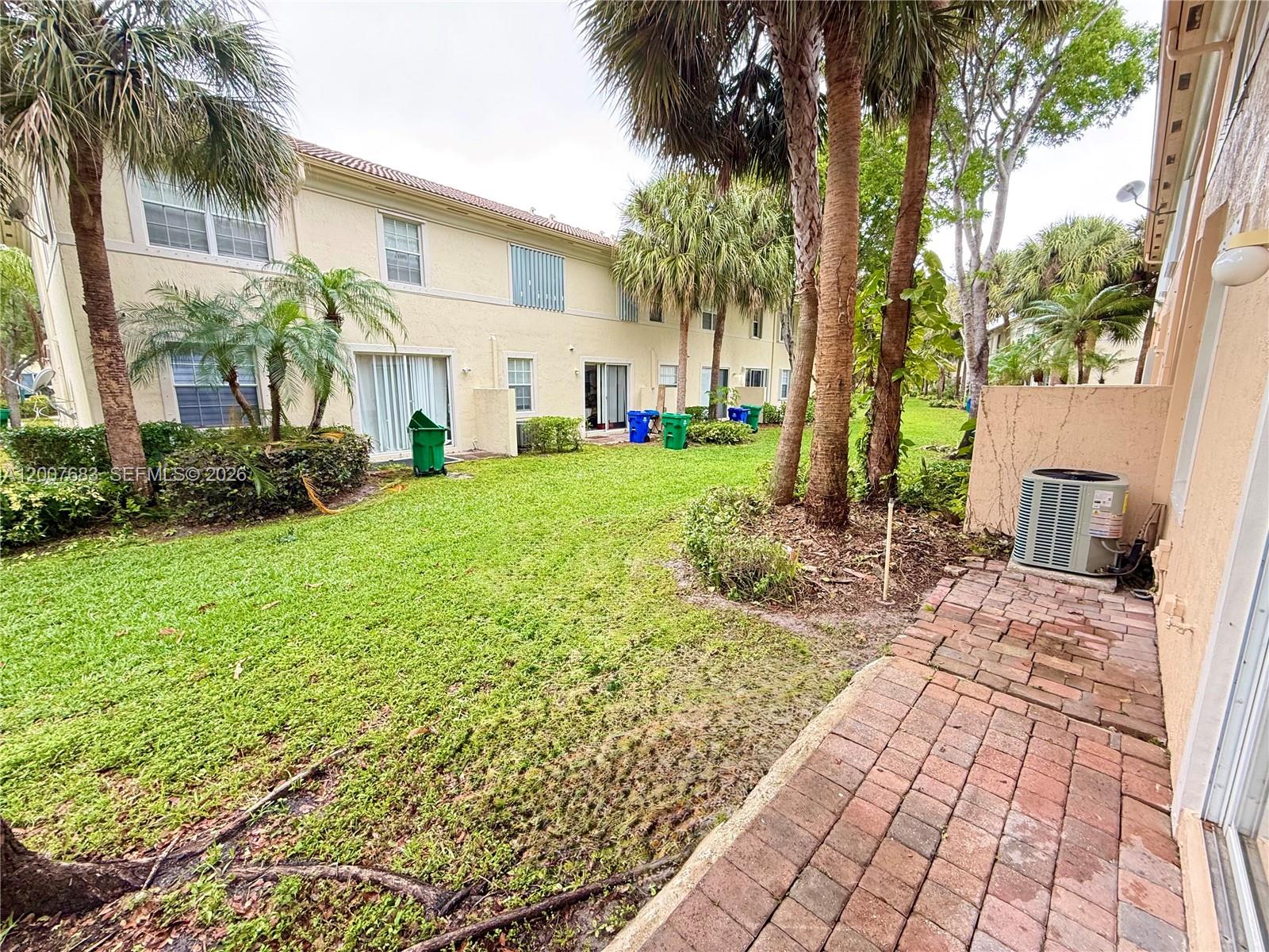 2674 Southwest 84th Terrace, Unit 102 Miramar, FL 33025 - Photo 53 of 57 a view of a backyard with a garden
