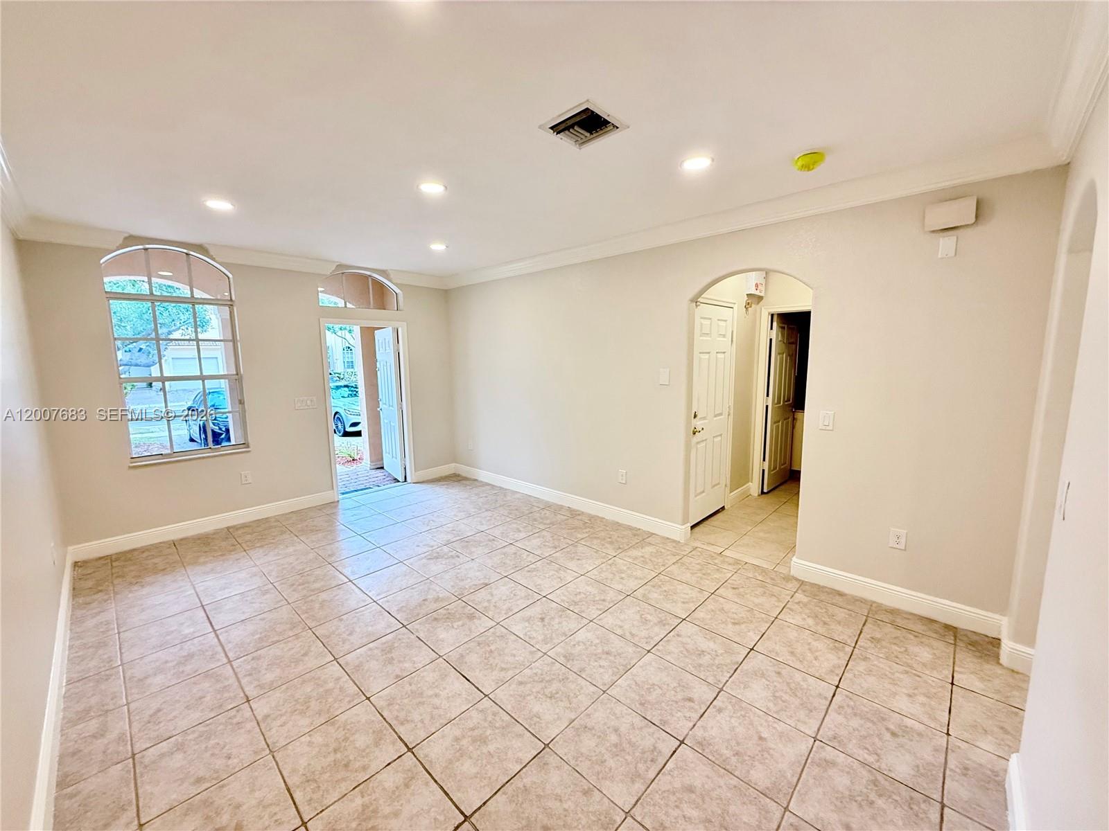 2674 Southwest 84th Terrace, Unit 102 Miramar, FL 33025 - Photo 9 of 57 a view of an empty room and window