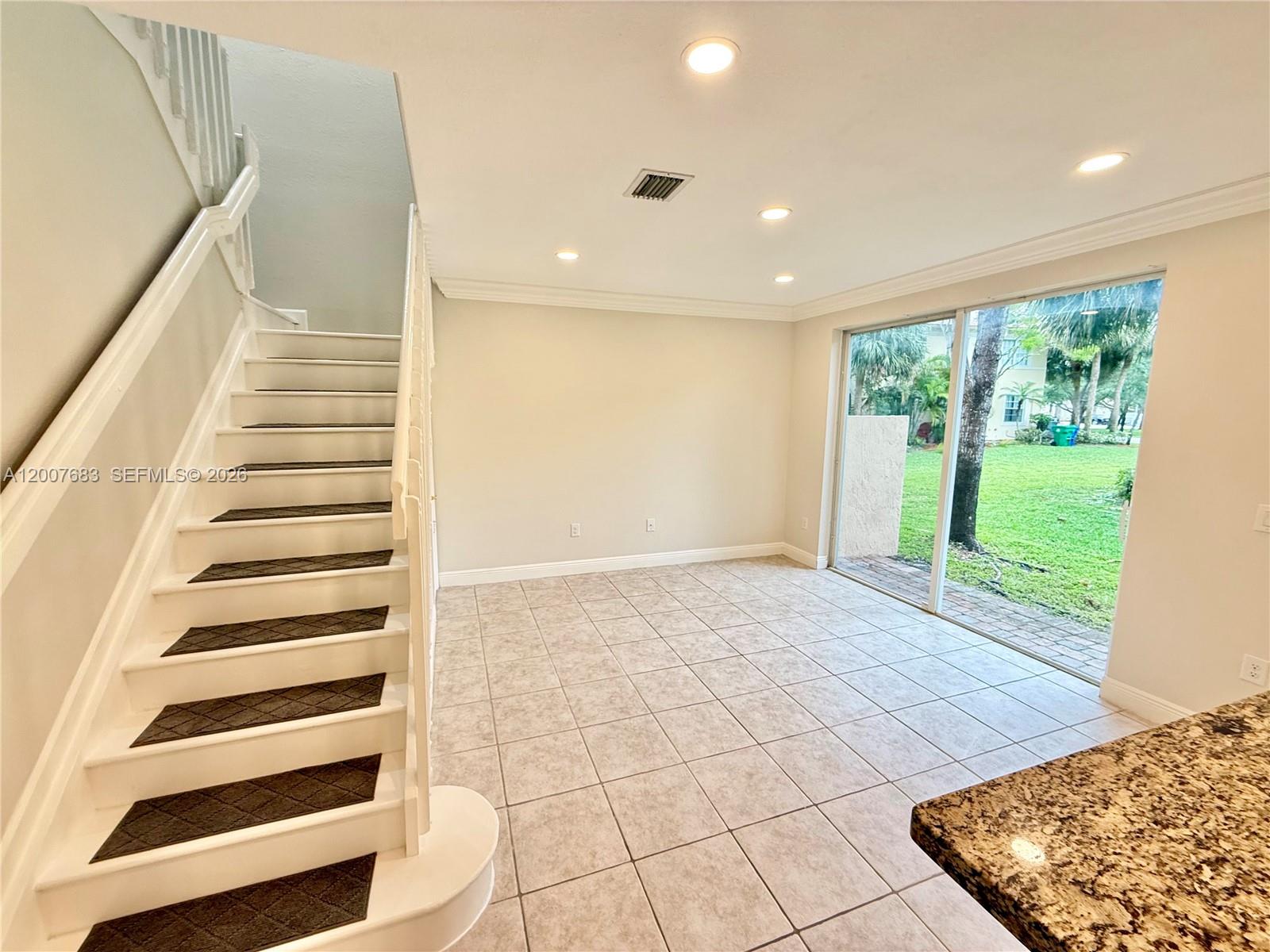 2674 Southwest 84th Terrace, Unit 102 Miramar, FL 33025 - Photo 10 of 57 a view of entryway with stairs and wooden floor