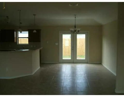 a view of a room with window wooden floor and windows