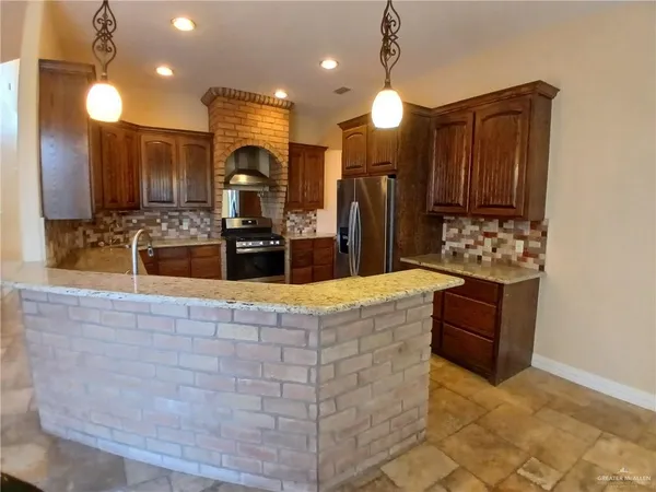 a large kitchen island with a large island in the center