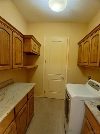 a utility room with a sink a washer and dryer