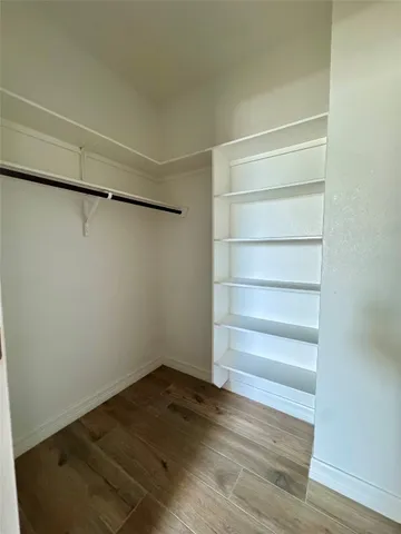 a view of a kitchen with a sink and a refrigerator