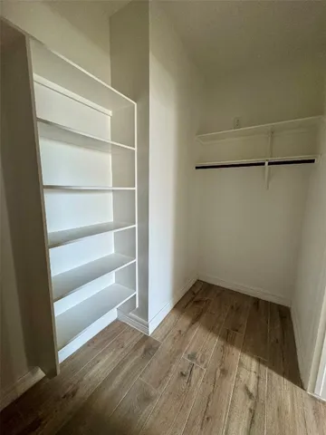 a view of an empty walk in closet