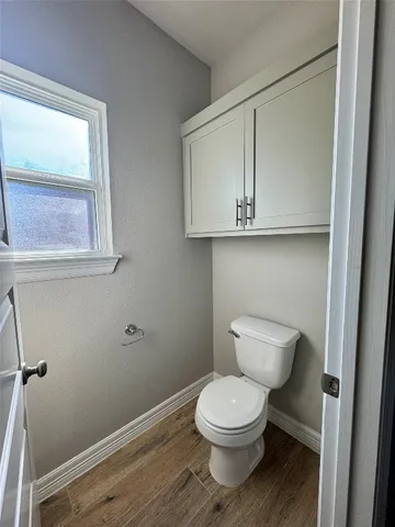 a spacious bathroom with a double vanity sink and a mirror