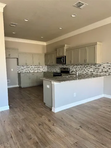 a view of gallery with wooden floor