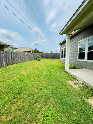 a bathroom with a granite countertop sink toilet a mirror and shower