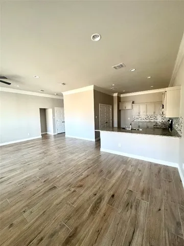 a kitchen with granite countertop a sink and a window