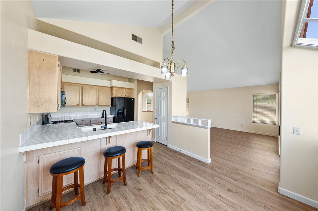 4930 Frazee Road Oceanside, CA 92057 - Photo 14 of 39 kitchen eat in dining area open to living room