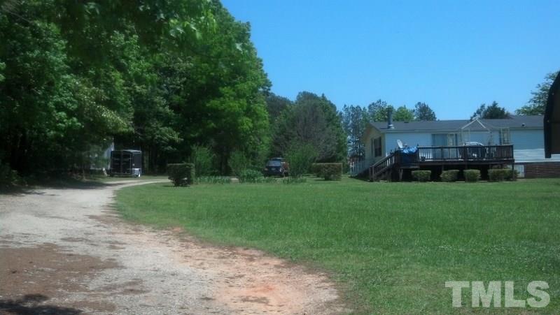 1135 B Lawrence Road Creedmoor, NC 27522 - Photo 2 of 13 a view of a garden with houses