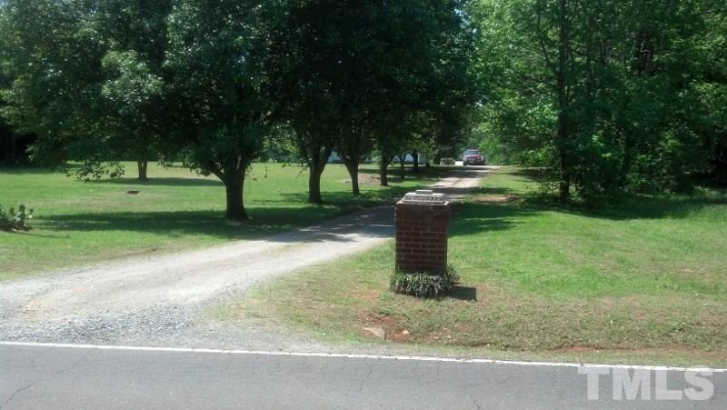 1135 B Lawrence Road Creedmoor, NC 27522 - Photo 12 of 13 a view of a garden with a tree