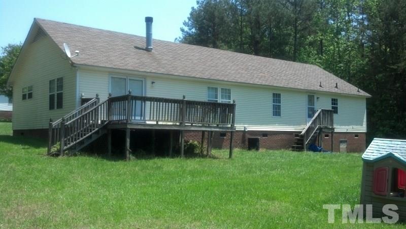 1135 B Lawrence Road Creedmoor, NC 27522 - Photo 3 of 13 a front view of a house with a yard table and chairs