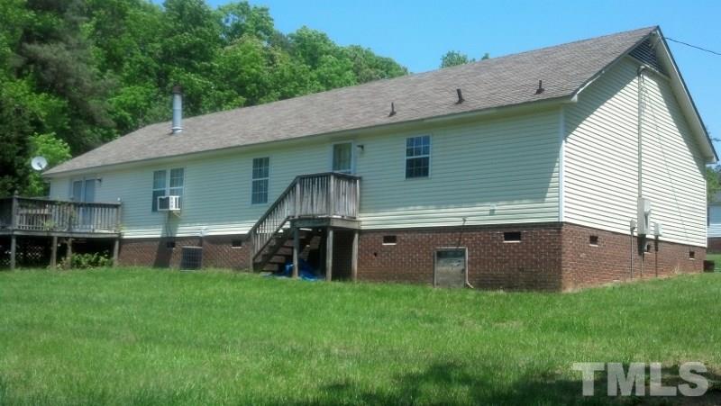 1135 B Lawrence Road Creedmoor, NC 27522 - Photo 5 of 13 a view of a house with a yard and sitting area