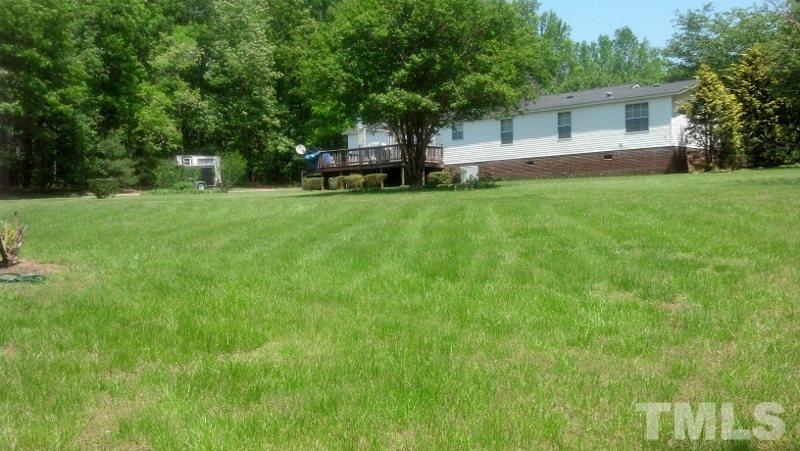 1135 B Lawrence Road Creedmoor, NC 27522 - Photo 7 of 13 a view of a house with a yard and tree