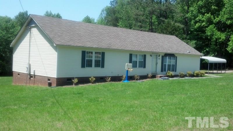 1135 B Lawrence Road Creedmoor, NC 27522 - Photo 8 of 13 a front view of house with yard and green space