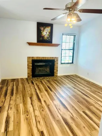 a bedroom with a bed and a fireplace
