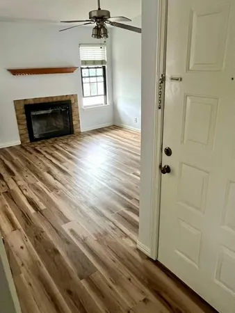 a bedroom with a bed and a fireplace