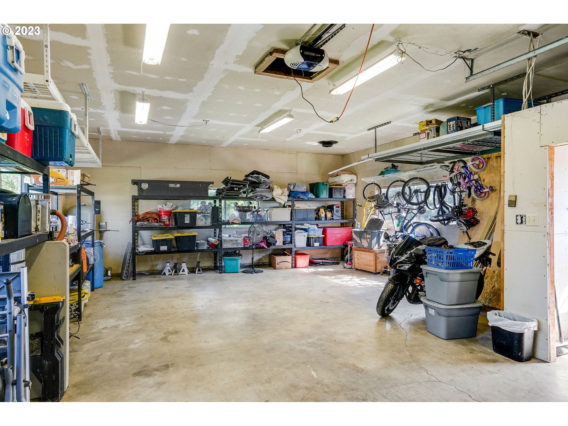 14410 Orchard Knob Road Dallas, OR 97338 - Photo 31 of 48 a view of a garage with a bike and a garage