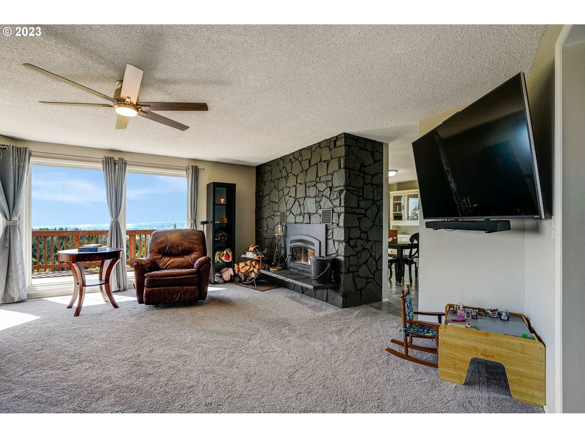 14410 Orchard Knob Road Dallas, OR 97338 - Photo 8 of 48 a living room with furniture and a flat screen tv