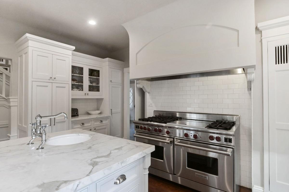 224 Warren Road San Mateo, CA 94402 - Photo 12 of 36 a kitchen with a stove and a sink