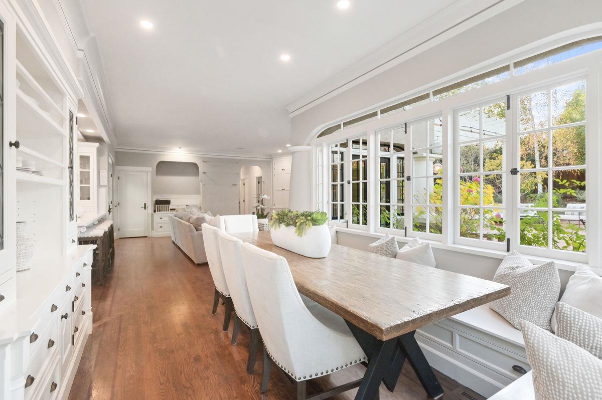 224 Warren Road San Mateo, CA 94402 - Photo 13 of 36 a view of a dining room with furniture large windows and wooden floor