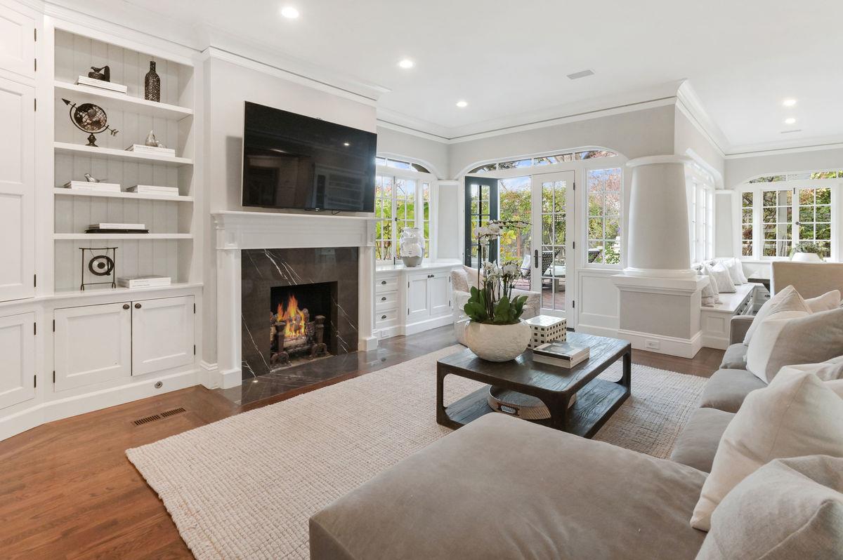 224 Warren Road San Mateo, CA 94402 - Photo 15 of 36 a living room with furniture a fireplace and a flat screen tv