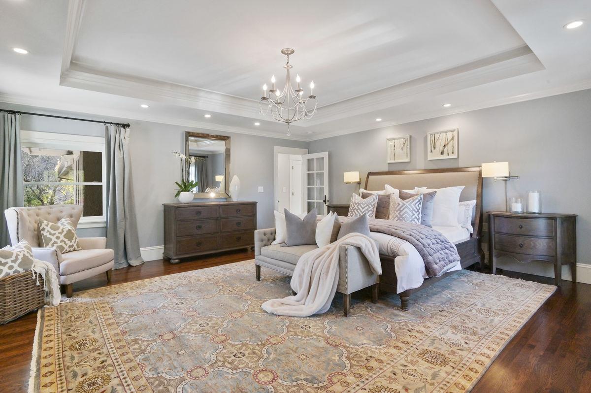 224 Warren Road San Mateo, CA 94402 - Photo 16 of 36 a spacious bedroom with a bed and ceiling fan