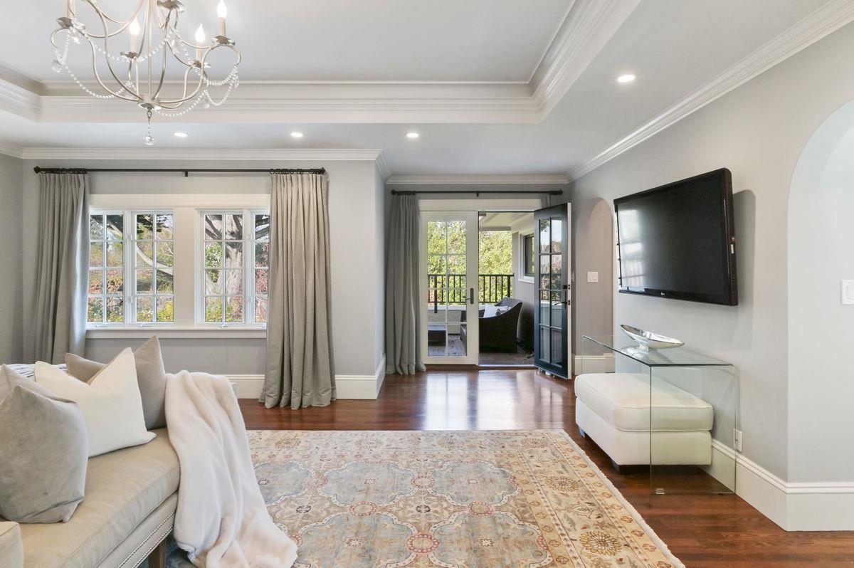 224 Warren Road San Mateo, CA 94402 - Photo 18 of 36 a living room with furniture and a flat screen tv