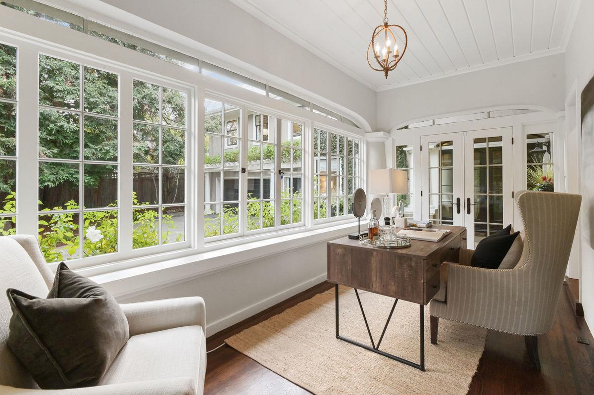 224 Warren Road San Mateo, CA 94402 - Photo 7 of 36 a view of a dining room with furniture wooden floor and a chandelier