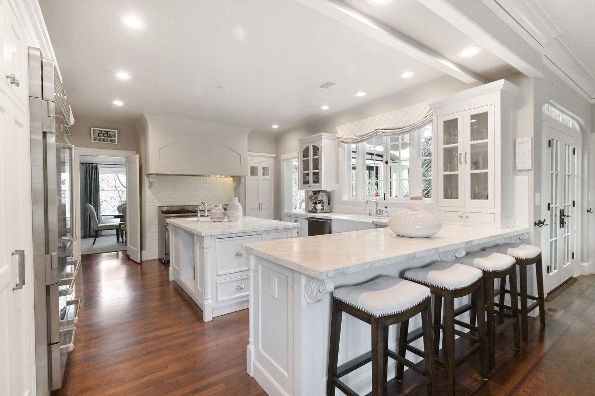 224 Warren Road San Mateo, CA 94402 - Photo 8 of 36 a large kitchen with a table and chairs