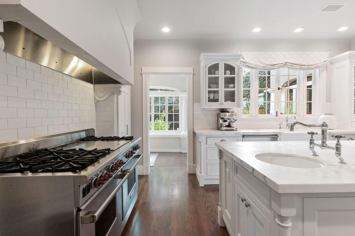 224 Warren Road San Mateo, CA 94402 - Photo 10 of 36 a kitchen with stainless steel appliances granite countertop a sink stove and cabinets